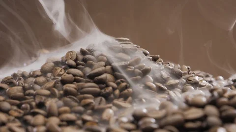 Offee beans rotate while roasting. Smoke comes from coffee beans. Stock Footage 119066050