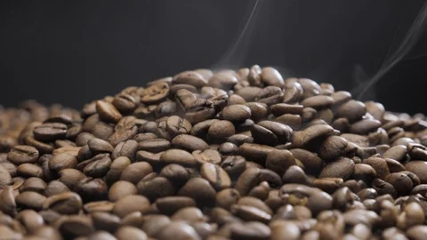 Offee beans rotate while roasting. Smoke comes from coffee beans. Stock Footage 119452221