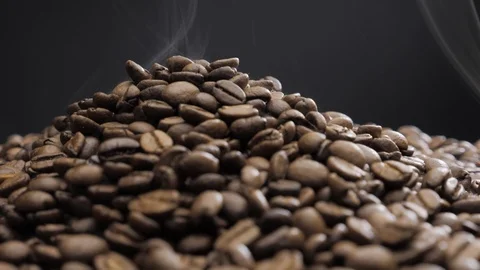 Offee beans rotate while roasting. Smoke comes from coffee beans. Stock Footage 119452271