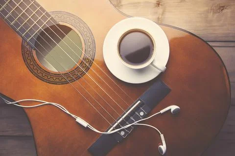 Offee, guitar and earphone Stock Photos