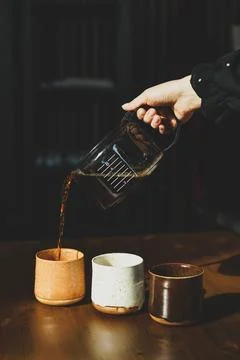 ?offee pours into the mug Stock Photos