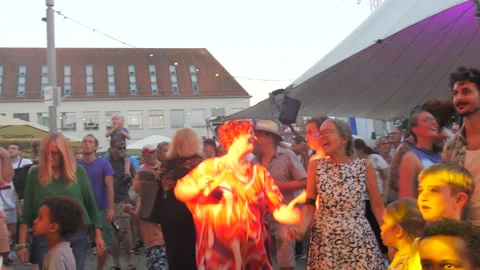 Offenburg, Germany - June 24, 2023: People dance and have fun at a concert on a Stock Footage 246604930