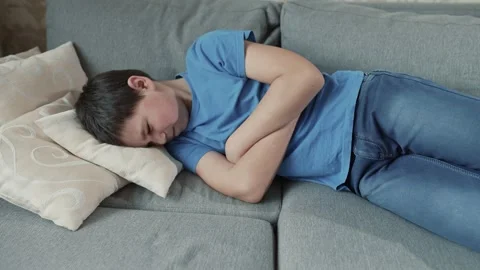 Offended boy on the couch Stock Footage 241437772