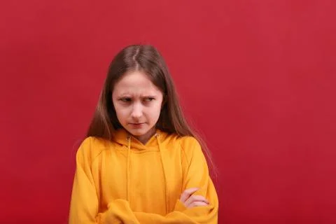 The offended girl put her hands together. Stock Photos