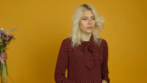 Offended girl refusing flowers and standing with crossed arms 스톡 동영상 129393326