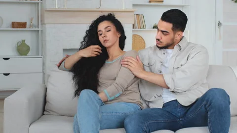 Offended upset worried desperate sad Hispanic Latino Caucasian woman wife Stock Footage 219804162