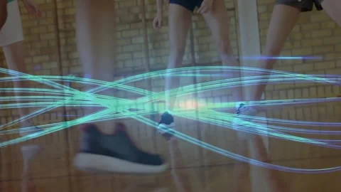 Offensive player starting dribbling on gym court activating glowing teal light Stock Footage 327004535