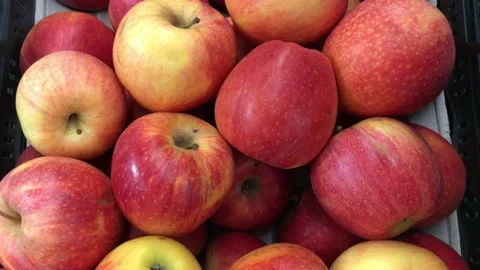 Offer red apples in the store. Sweet pleasure is laid out on a paper mat Stock Footage 132872679