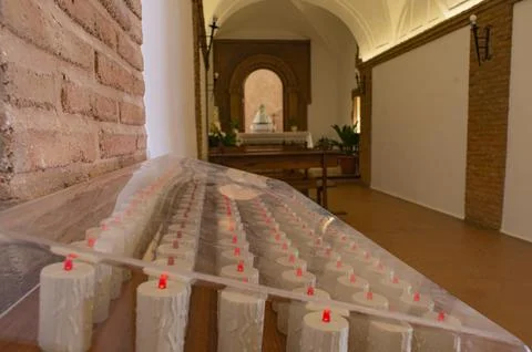 Offering of candles inside the chapel of the Sanctuary of the Virgen del Mont Stock Photos