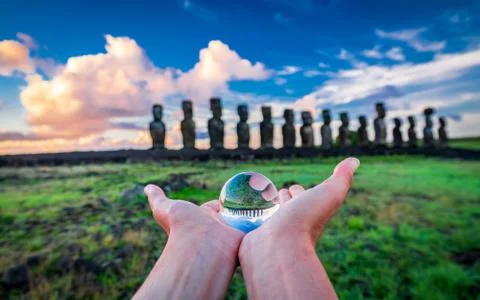 Offering crystal ball to moai platform at dawn Stock Photos