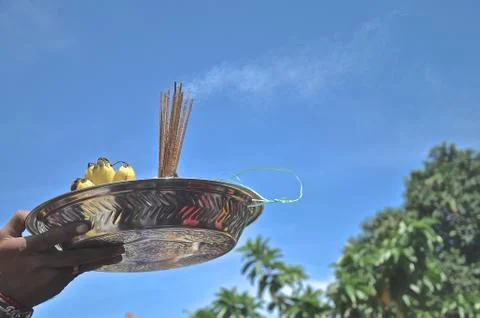 Offering dish with joss sticks. Stock Photos