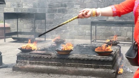 Offering fire ritual to the lord Shiva Stock Footage 76538994
