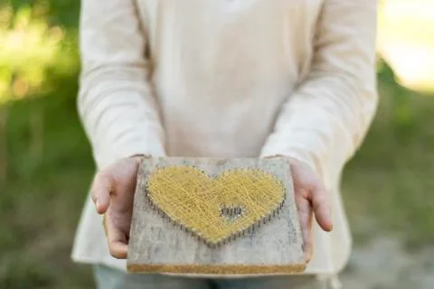 Offering heart with closed palms Foto stock