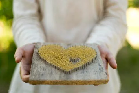 Offering heart with closed palms Stock Photos