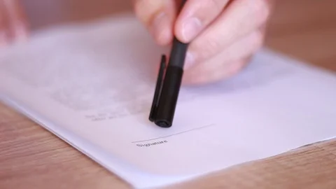 Offering to put signature under the contract Stock Footage 95771297