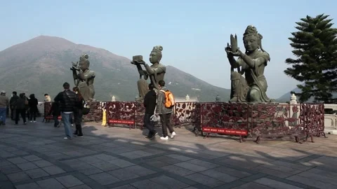 The Offering Of The Six Devas Statues in Hong Kong, Tourists Walking By Stock Footage 208677970