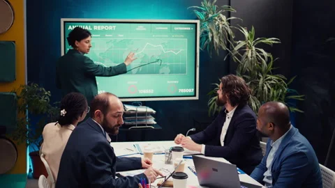 Office administrator presenting data reports and funding on interactive board Stock Footage 272182618