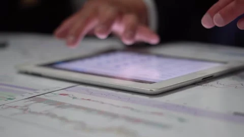 In the office analysis and discussion of the trader of the stock market mark Stock Footage 283797547