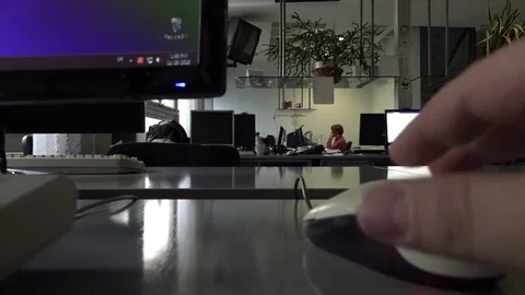 Office atmosphere with the computer mouse in the foreground Stock Footage 70499095
