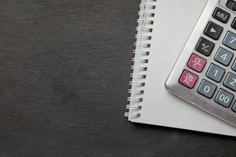 Office black table with calculator, notepad. Stock-Fotos