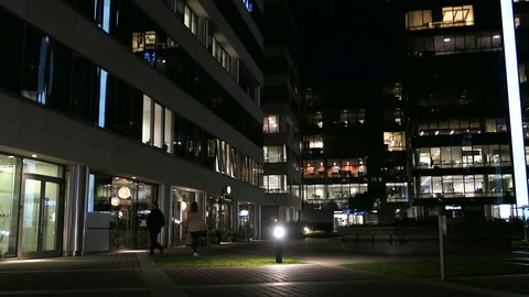 Office Blocks and Workers Working Late Hours at Night Stock Footage 99056281