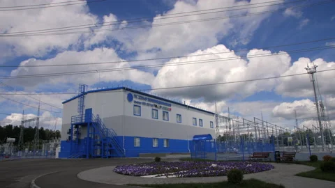 Office building and flowerbed with logo near substation Stock Footage 154220087