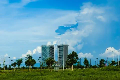 Office Building background with thick clouds in the summer blue sky. Cloudy.. Stock Photos