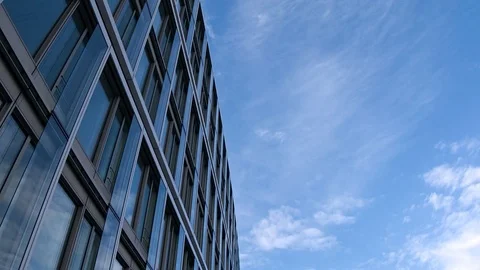 Office building on blue sky white clouds timelapse Stock Footage