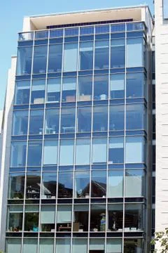 An office building with a clear view of the inside of the offices Stock Photos