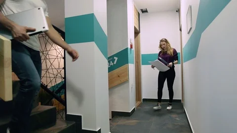 Office building corridor during the day with passing people. Time lapse video. Stock Footage 103859295