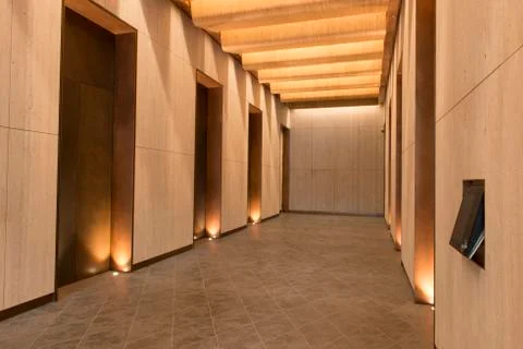 Office Building Elevator Hall with Warm Lighting Stock Photos