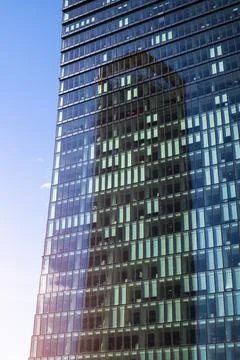 Office building facade with reflection on windows Stock Photos