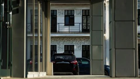 Office building, framing, diagonal, car in the distance Stock Photos