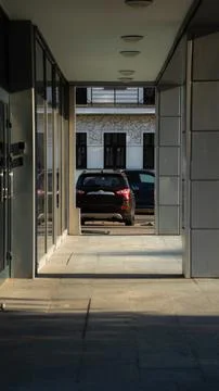Office building, framing, diagonal, car in the distance Stock Photos
