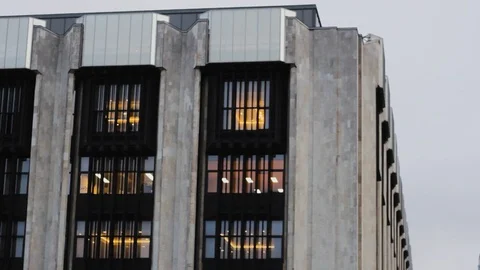 Office building made of stone. with lighted offices. facade and concrete 스톡 동영상 119498266