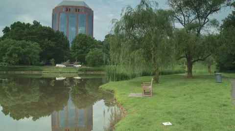 Office building reflecting on a pond Stock Footage 35722568