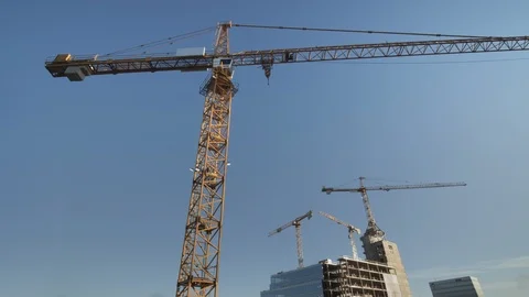 An office building under construction against a blue sky. 스톡 동영상 120600969