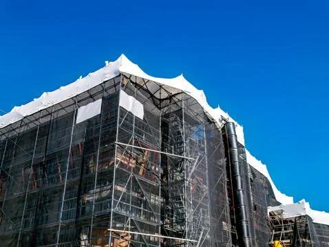 Office building under construction on blue sky background Stock Photos