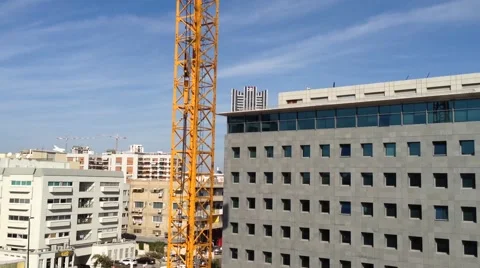 Office Building Under construction - Habarzel 30 Tel Aviv- Crane holding a plate Stock Footage 48609930