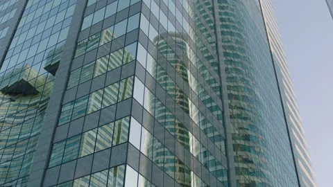 Office building windows and bottom view of skyscraper Stockbeeldmateriaal 239227024