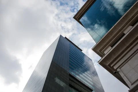 Office buildings with clouds in the background Stock Photos