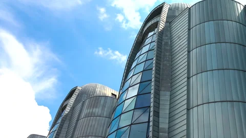 Office builiding on the time lapse cloudscape on the blue sky background. 스톡 동영상 244218501