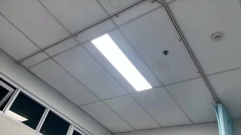 Office ceiling with bright rectangular led panel light and window frame 库存影片 334949139