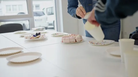 Office Celebration with Cake, Refreshments, and Cheerful Colleagues for a Stock Footage 303597436