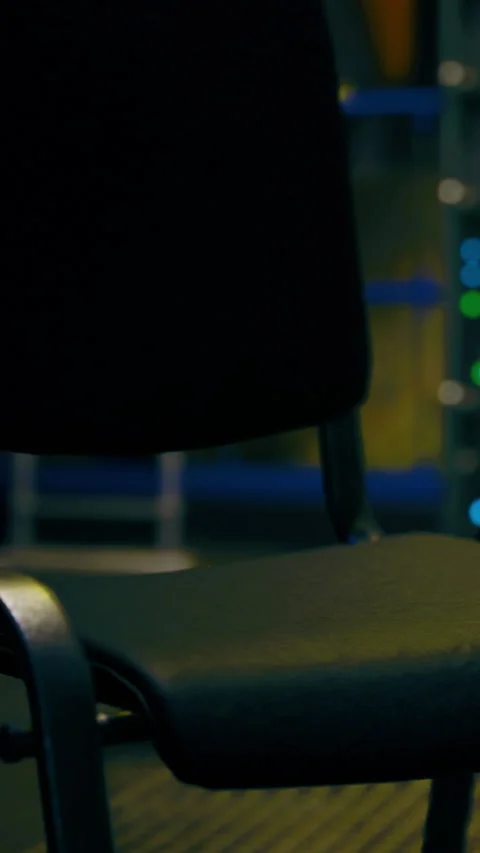 Office chair in modern workspace with computer equipment and lights Видео 334265119