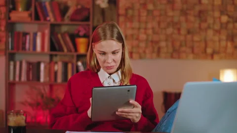 In the office charismatic lady with a electronic tablet working online she Stock Footage 136538747