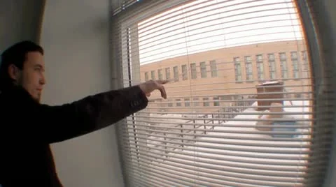 Office clerk looking at whe window Stock Footage 22022470