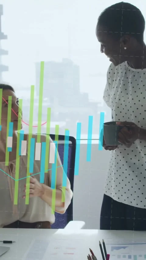 In office, colleagues discussing work with animation of financial graphs Stock Footage 344404150