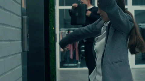 Office Colleagues Performing Dance Moves by Elevators 動画素材 285829137