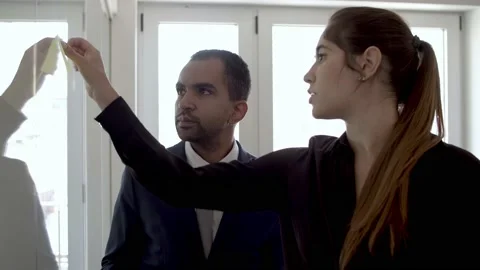 Office colleagues working on project together Stock Footage 137513154